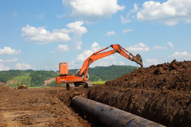 Pipeline coming from storage tanks clipart