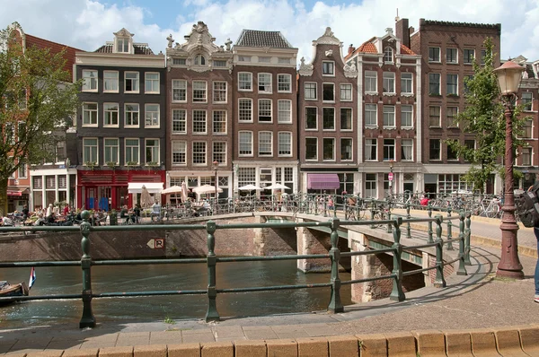 Bridge in Amsterday with a lot of bikes — Stock Photo, Image