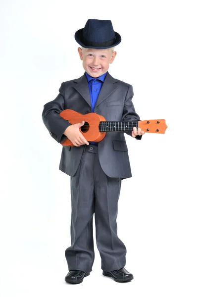 Niño inteligente con guitarra —  Fotos de Stock