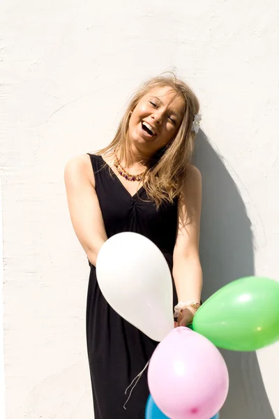 Joyful girl with balloons — Stock Photo, Image