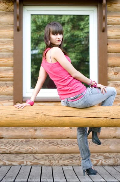 Chica sentada en una veranda — Foto de Stock