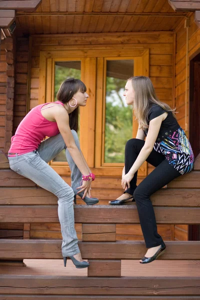 Two female friends on a veranda — Stock Photo, Image