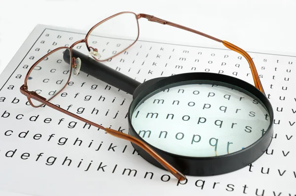 Magnifier and glasses — Stock Photo, Image