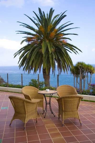 stock image Coffee table with four rattan chairs and