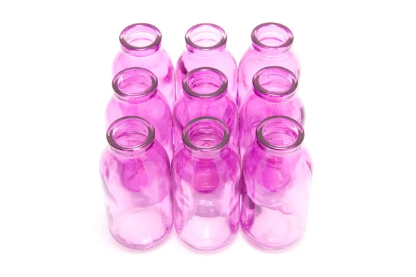 Roze flessen samen — Stockfoto