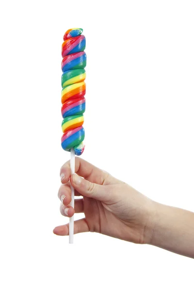 Hand is holding lollipop — Stock Photo, Image