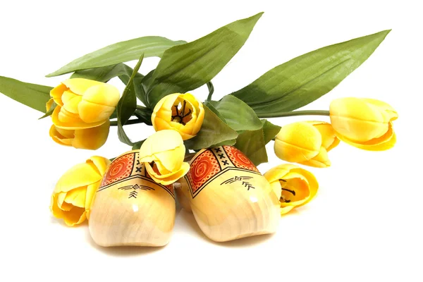 stock image Dutch wooden shoes and silk tulips