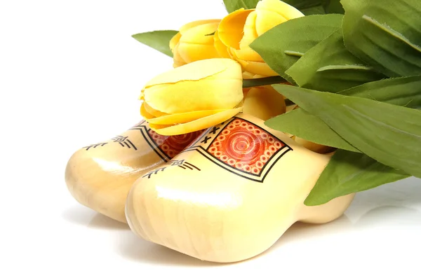 stock image Dutch wooden shoes and silk tulips