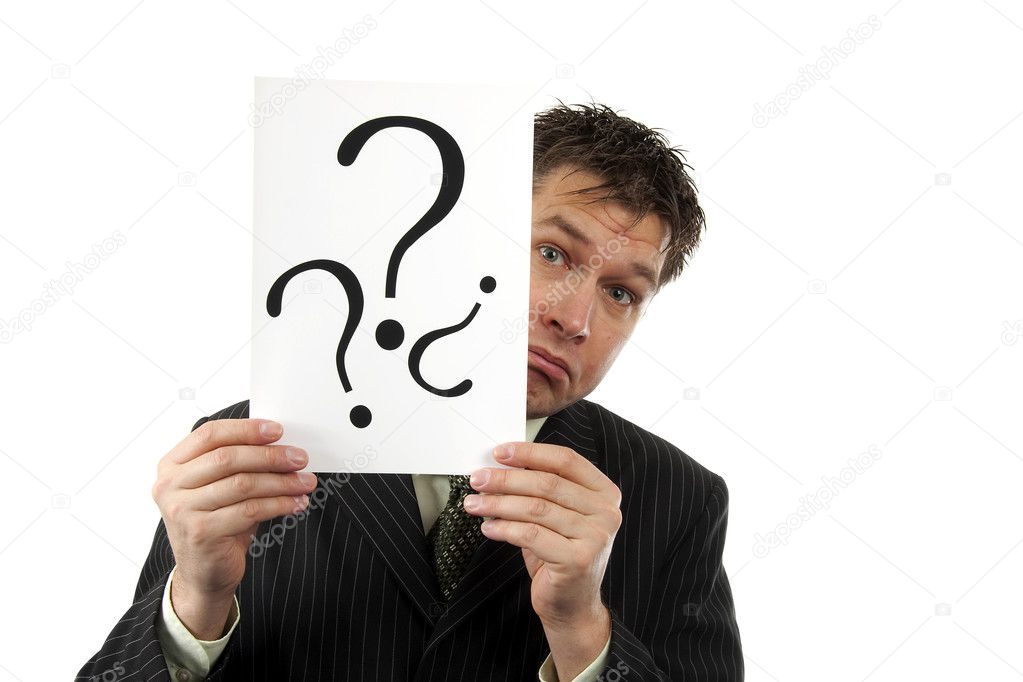 Businessman is holding question marks
