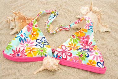 Bikini top on beach clipart