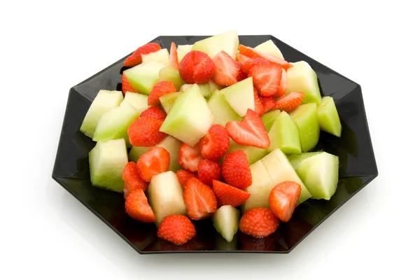 Teller mit Erdbeere und Melone — Stockfoto