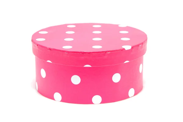 Scatola rotonda rosa con puntini bianchi — Foto Stock