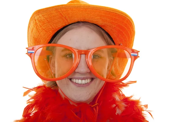 Fotbalový fanoušek s velké oranžové brýle — Stock fotografie