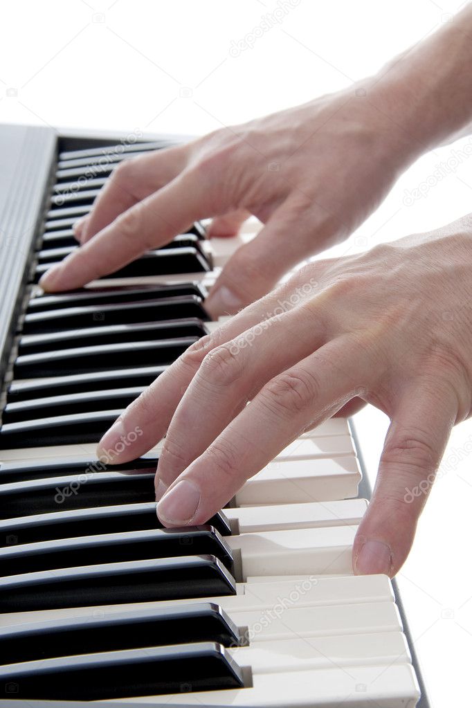 Hands are playing the piano