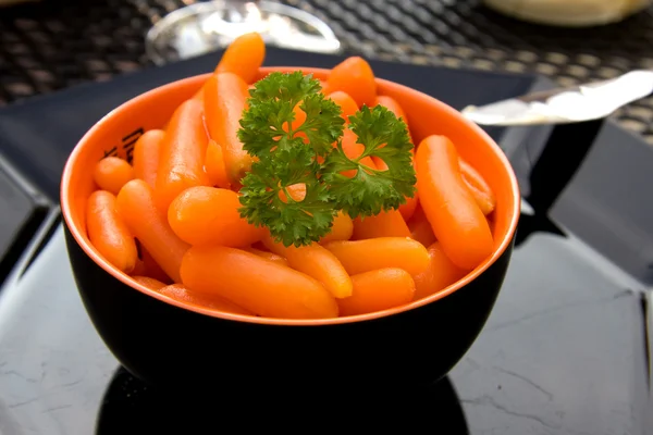 Bowl with fresh carrots — Stock Photo, Image