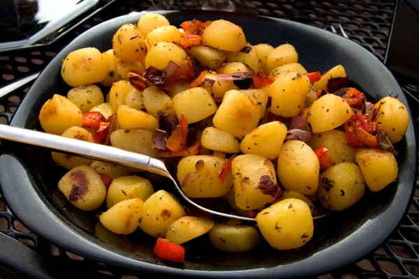 Plate with fresh baked potatoes — Stock Photo, Image