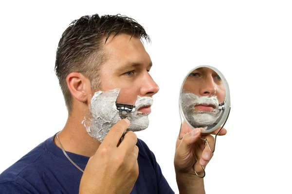 Człowiek jest golenie twarzy — Zdjęcie stockowe