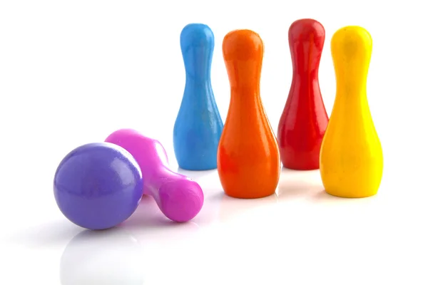Colorful bowling pins and ball — Stock Photo, Image