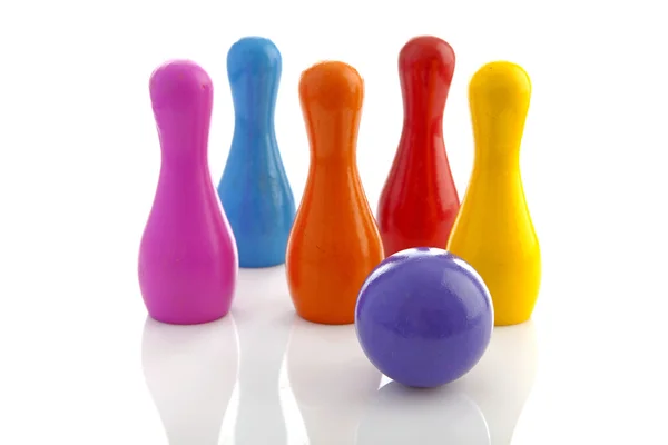 Colorful bowling pins and ball — Stock Photo, Image