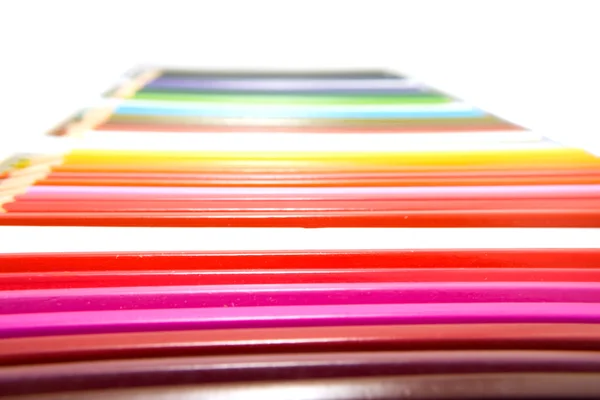 Colored pencils in a row — Stock Photo, Image