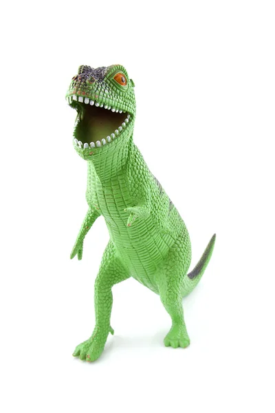 Зеленые динозавры играют в игрушки — стоковое фото