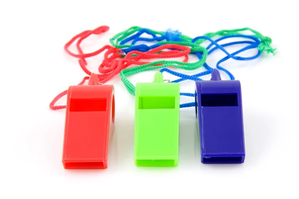 Τρία χρωματιστά πλαστικά σφυρίχτρες — Φωτογραφία Αρχείου