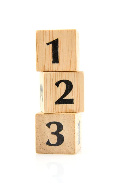 Bloques de madera apilados con números — Foto de Stock