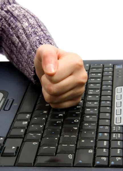 Fist on computer keyboard — Stock Photo, Image