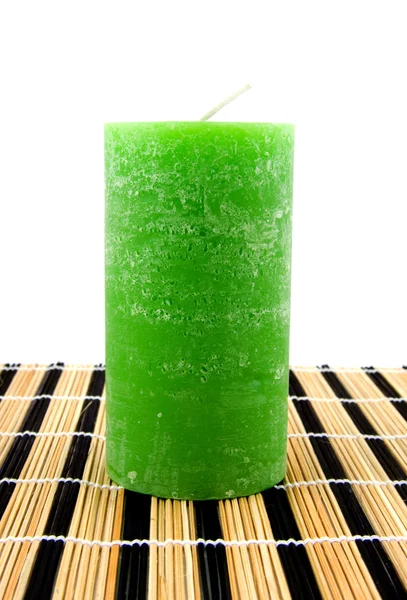 Зелена свічка на маті на очереті — стокове фото