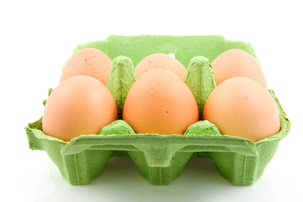 Six chicken eggs in green carton — Stock Photo, Image