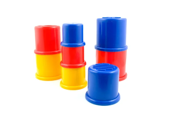 Brinquedos de plástico empilhados — Fotografia de Stock