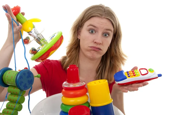 Mulher com muitos brinquedos — Fotografia de Stock