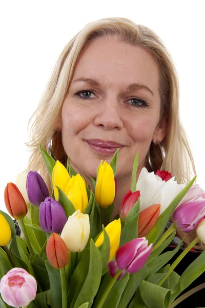 Stock image Woman with Dutch tulip flowers