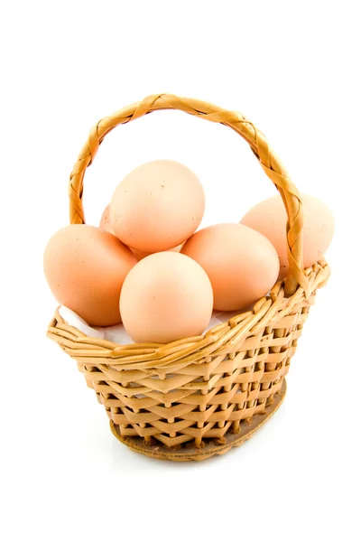 Cane basket with chicken eggs — Stock Photo, Image