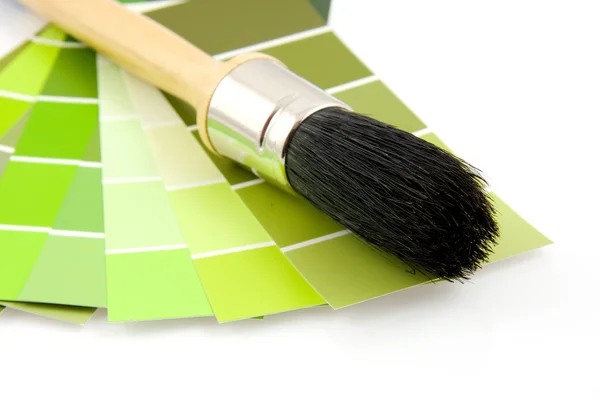 stock image Green color samples and paint brush