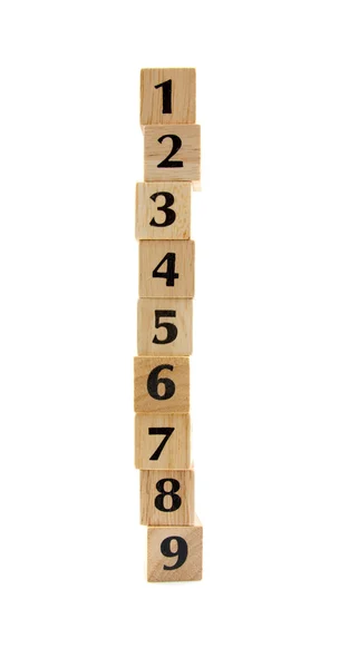 Укладываемые деревянные блоки с числами — стоковое фото