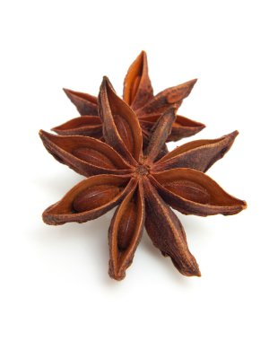 Two whole star anise in closeup clipart