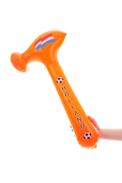 Hand mit gesprengtem orangefarbenen Hammer — Stockfoto