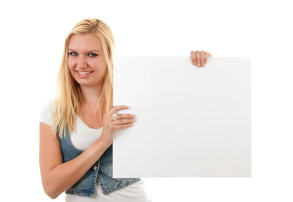 Woman is holding empty board — Stock Photo, Image