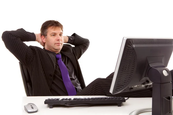 Businessman is sitting relaxed — Stock Photo, Image