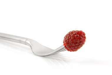 Fresh raspberry on fork clipart