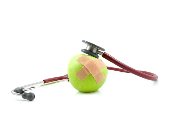 Chory jabłko z patchami i botami stetoskop — Zdjęcie stockowe