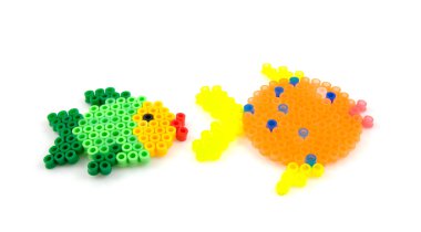 Bead arts in the shap of fish clipart