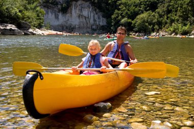 Father and daughter in canoe clipart