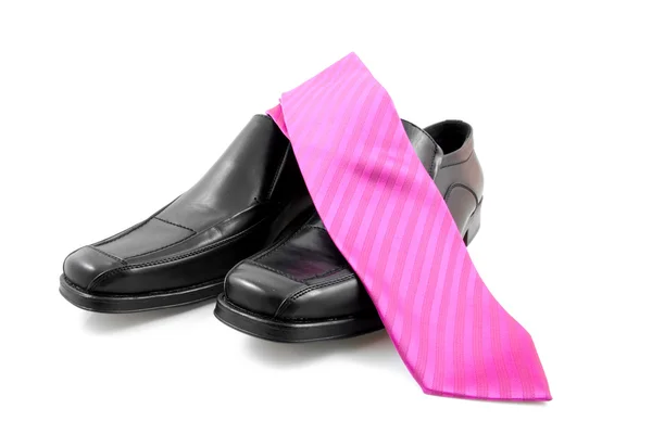 Pair of black male business shoes and pink tie — Stock Photo, Image