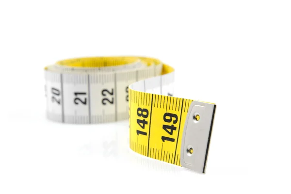 White and yellow measure tape in closeup — Stock Photo, Image