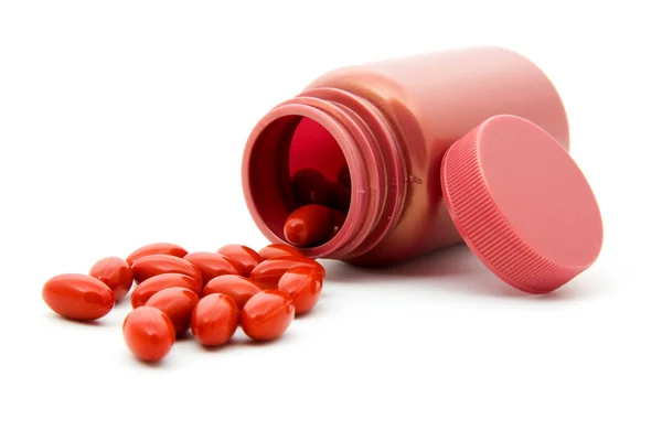 Pills next to bottle — Stock Photo, Image