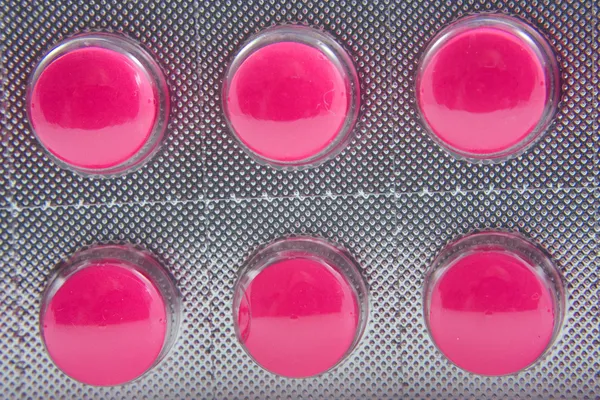 Geneeskunde strip met roze pillen — Stockfoto