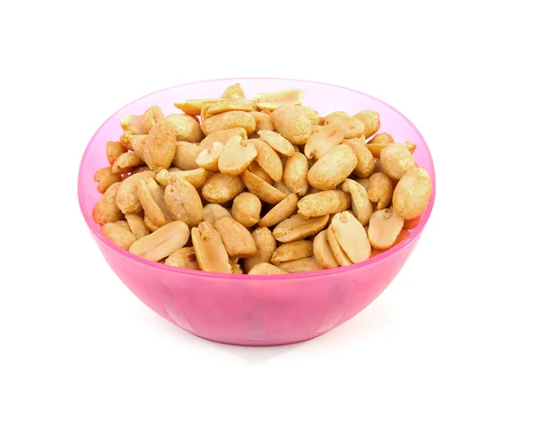 Pink bowl with salted peanuts — Stock Photo, Image