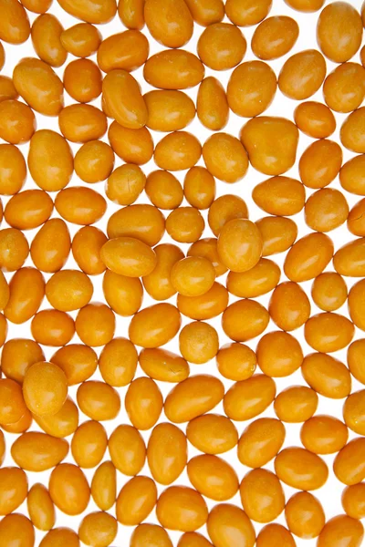 Orzeszki ziemne pomarańczowe tło — Zdjęcie stockowe